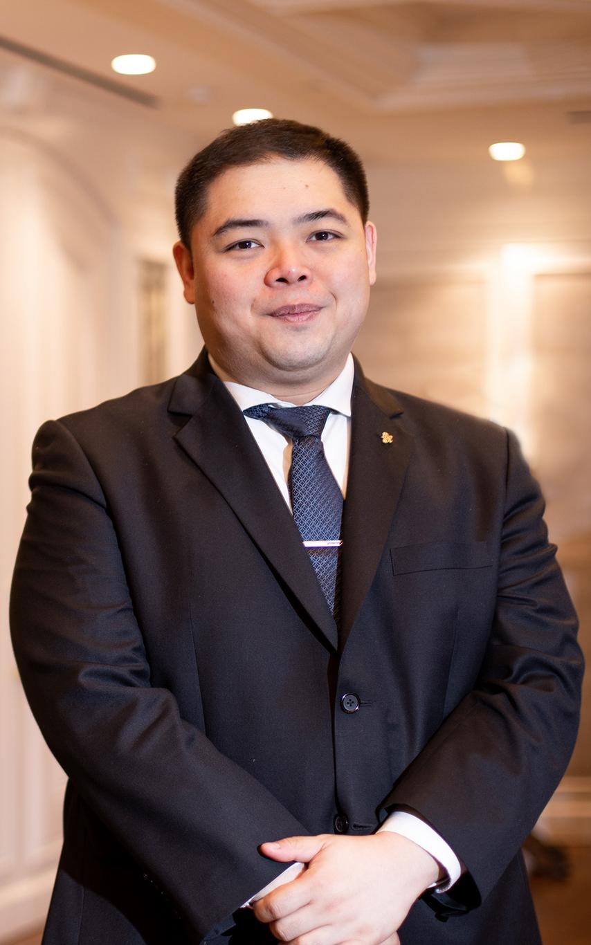 A young man in a suit. 